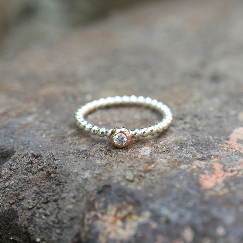 Beisteckring mit einem 0,06 ct Diamant