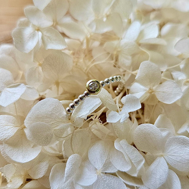 Beisteckring mit einem 0,06 ct Diamant
