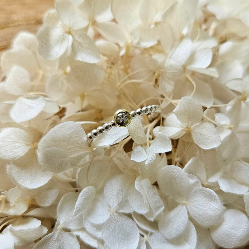 Beisteckring mit einem 0,06 ct Diamant