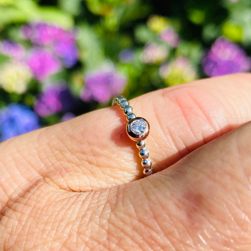 Beisteckring mit einem 0,06 ct Diamant