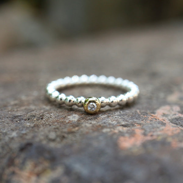 Kugelring mit Zargenfassung – 925 Silber & 585 Gelbgold, Diamant 0,03 ct