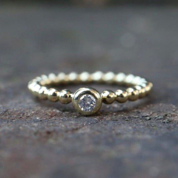 Beisteckring Kügelchen mit einem 0,11 ct Diamant