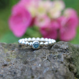 Beisteckring mit einem blau Topas